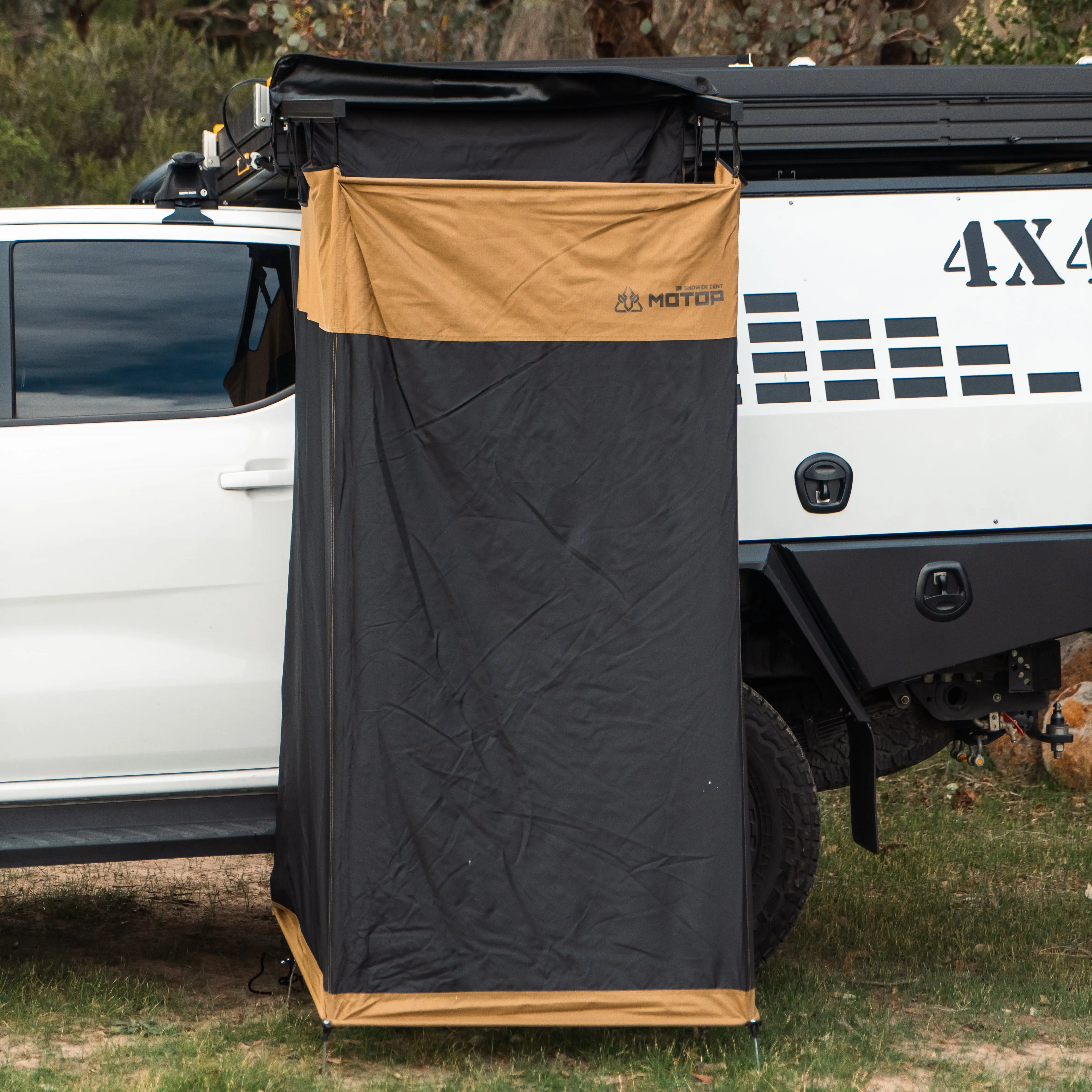 Motop vehicle-mounted shower tent detail showing durable fabric, aluminium frame and easy setup system