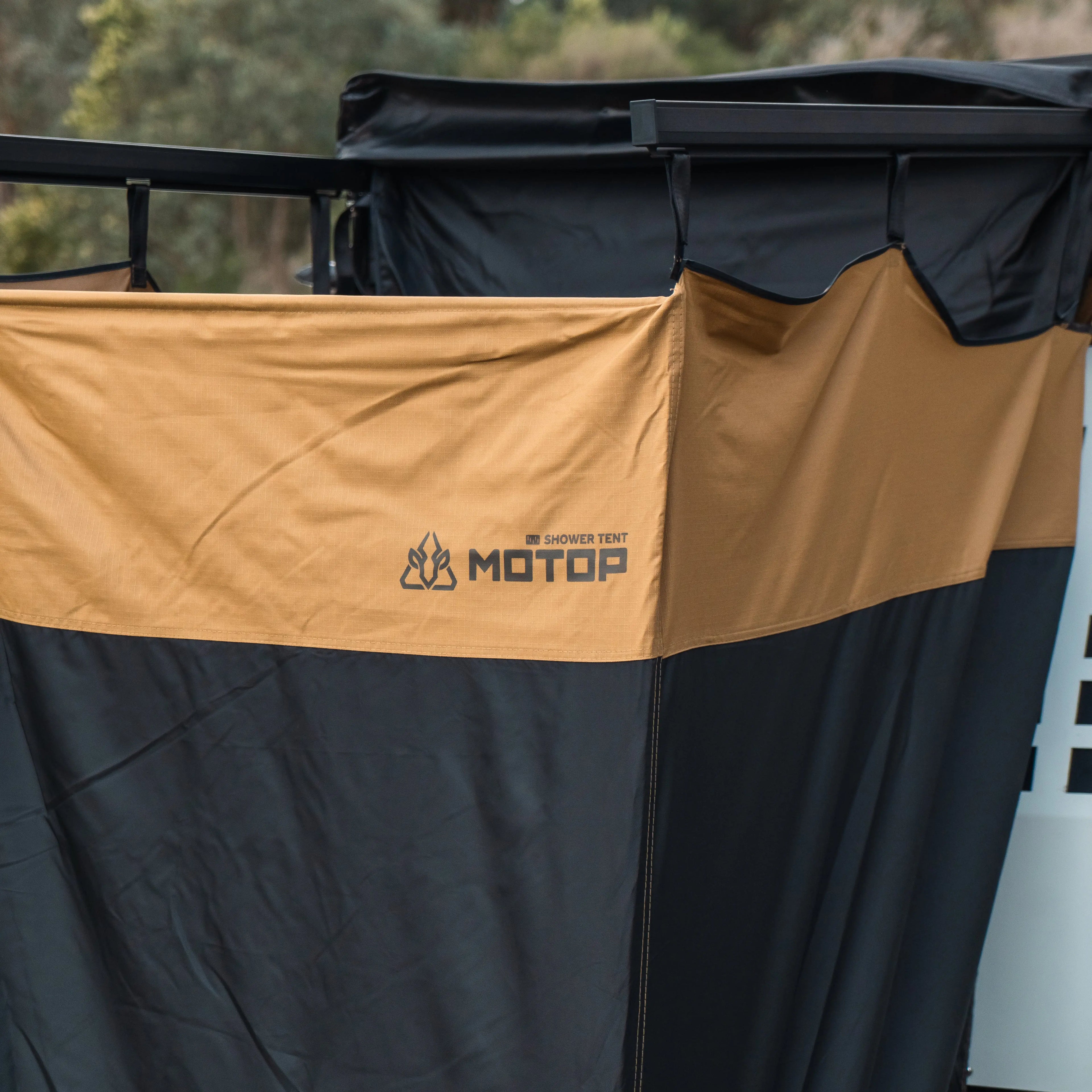 Weatherproof Motop shower tent providing privacy for beach and bush camping.