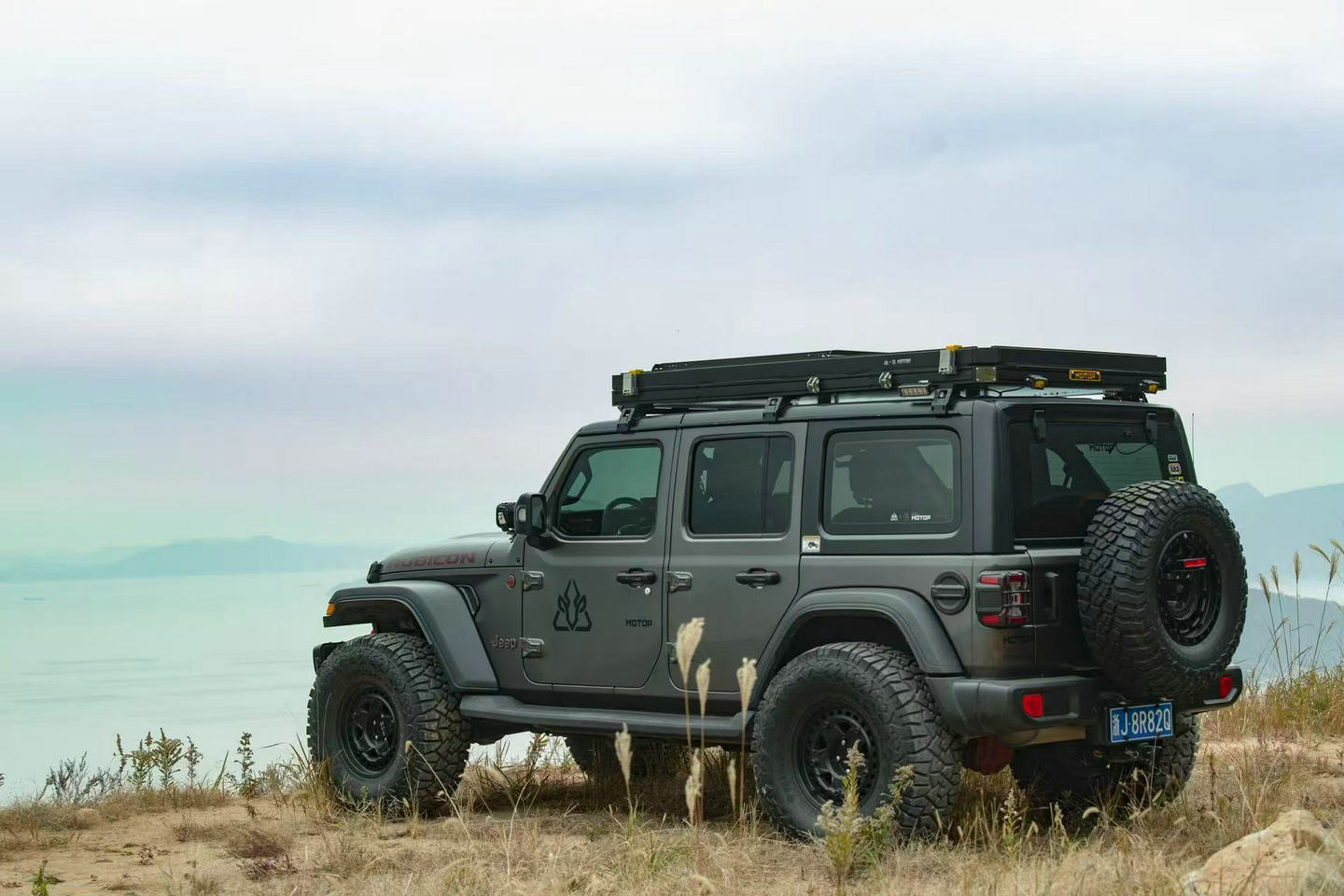 Interior of Motop X Series AX-530 Plus rooftop tent with 60mm memory foam mattress, blackout lining and LED lighting