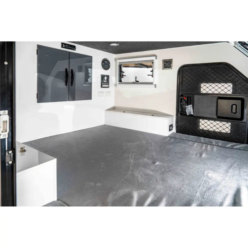 Camper with high-quality mattress and blackout blinds for a cozy and dark sleeping environment.